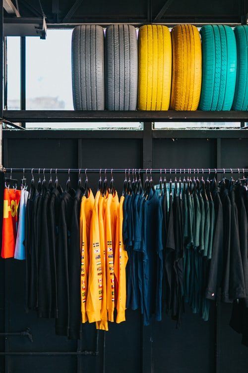 assorted-color clothes hanged on rack