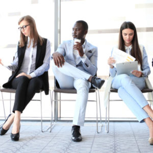 Group of business professionals sitting with resume