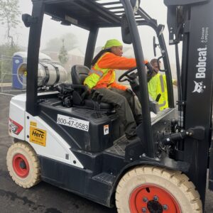 Britanny operating a forklift.